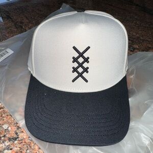 RHONE Black and White Trucker Hat